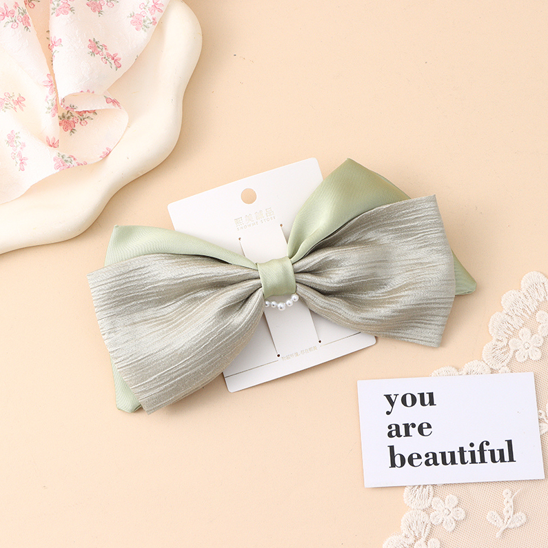 Solid color bow bead cross clip