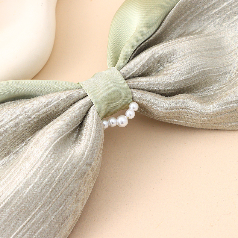 Solid color bow bead cross clip