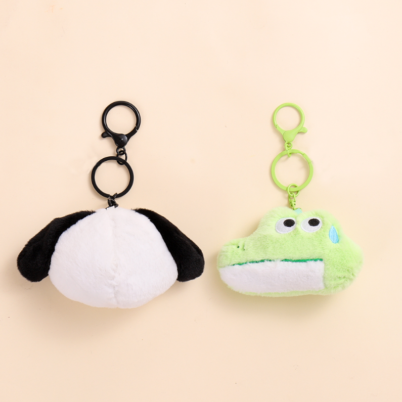 The animal presses the rattle plush pendant